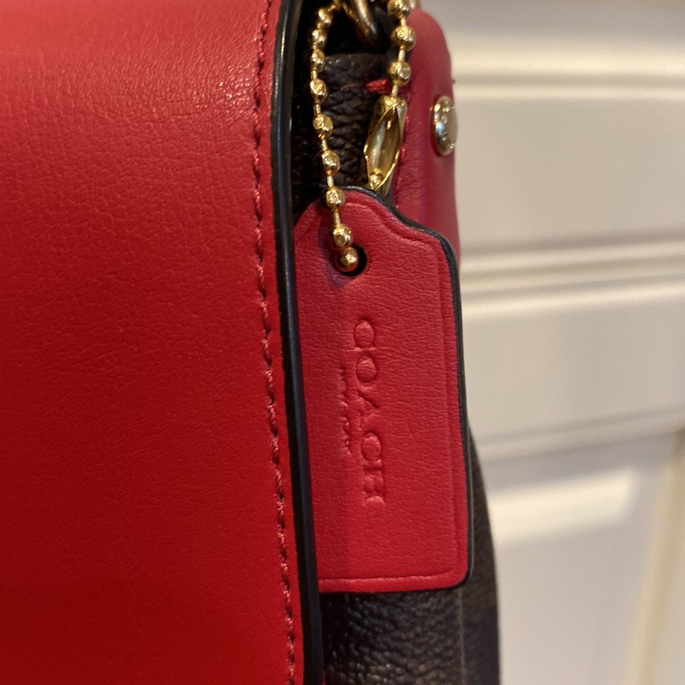 This is a like new coach cross body bag. - Picture 8 of 9
